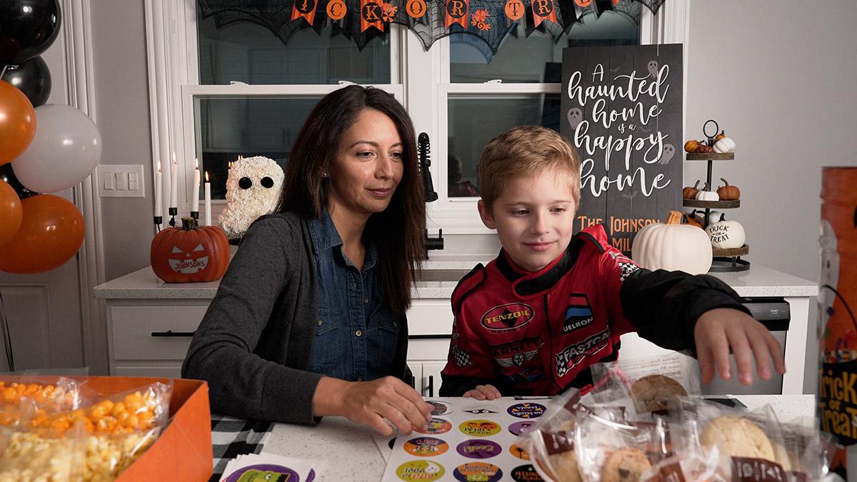 mother and son making boo bags together