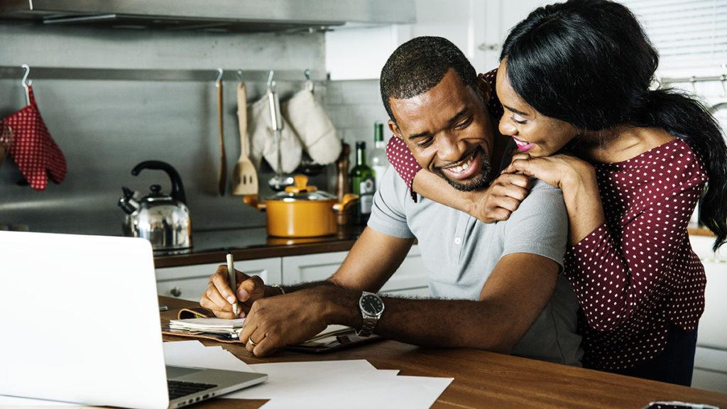 at home date night ideas with couple making a bucket list