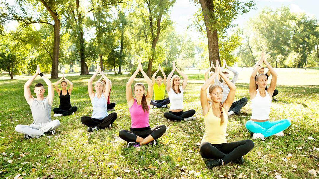 spring self care ideas: adults doing yoga