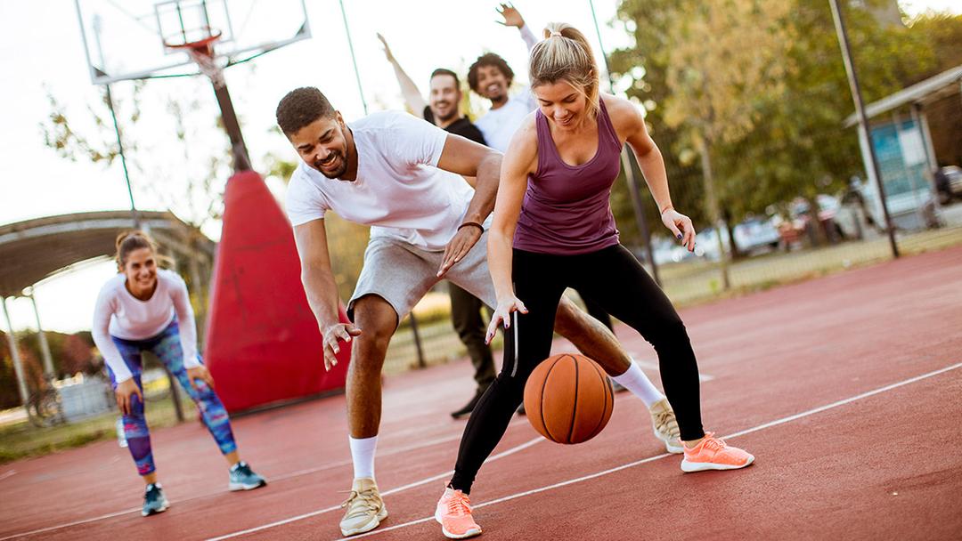 spring self care ideas: adults playing basketball