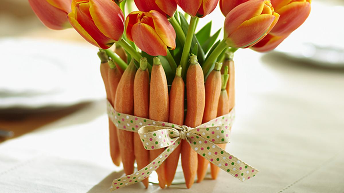 a photo of easter brunch ideas: carrot vase tied with ribbon