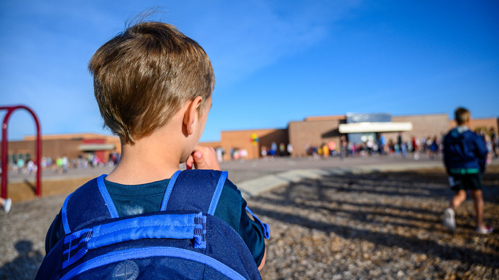 Photo of kid looking nervous at school