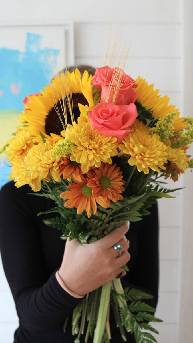 https://www.cheryls.com/blog/wp content/uploads///woman holding bouquet of flowers