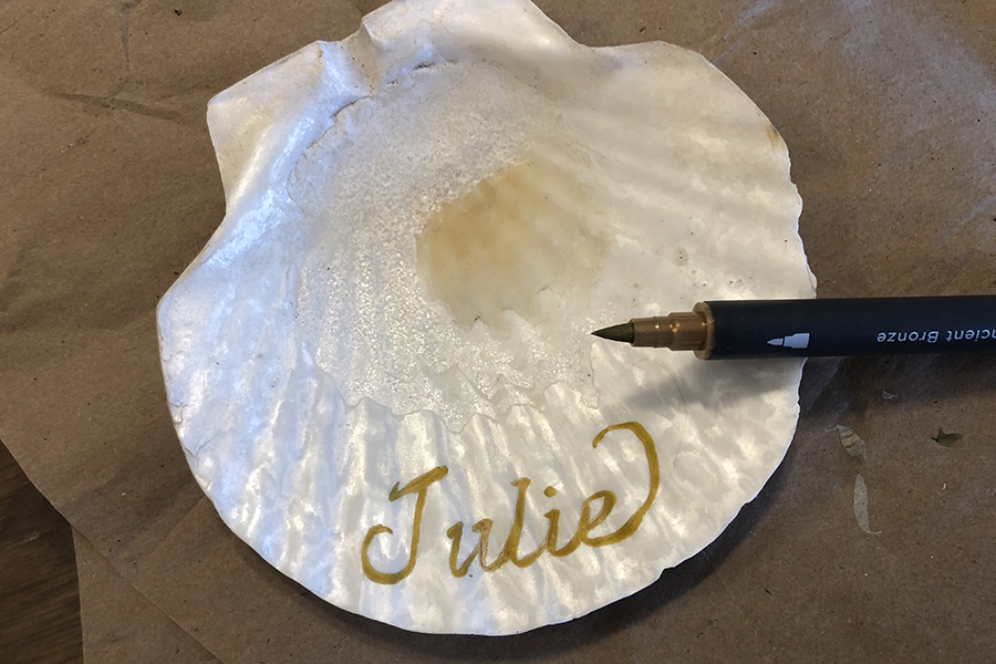 Photo of a shell with the name "Julie" written on it