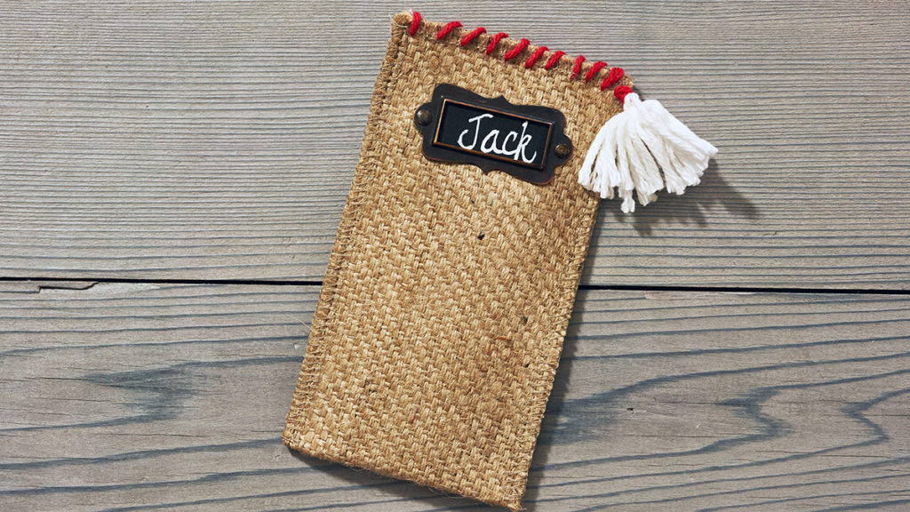 Photo of burlap cutlery holder with pom pom