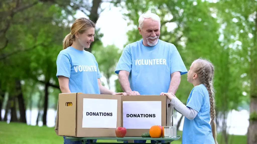 Photo of family taking donations
