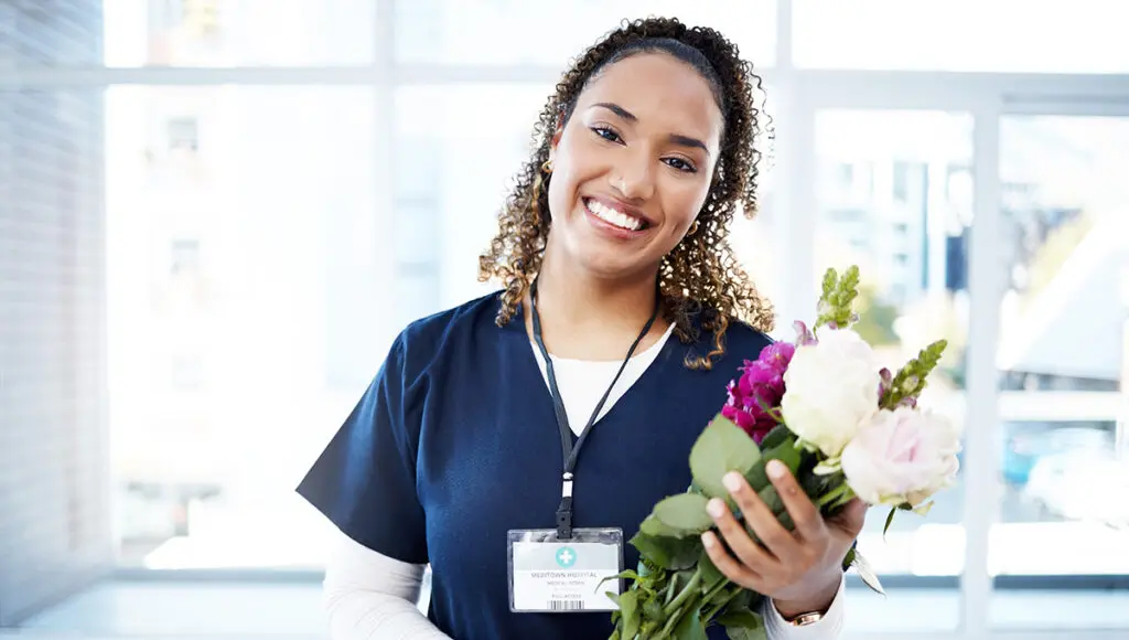 nurses week nurse holding a bouquet of flowers