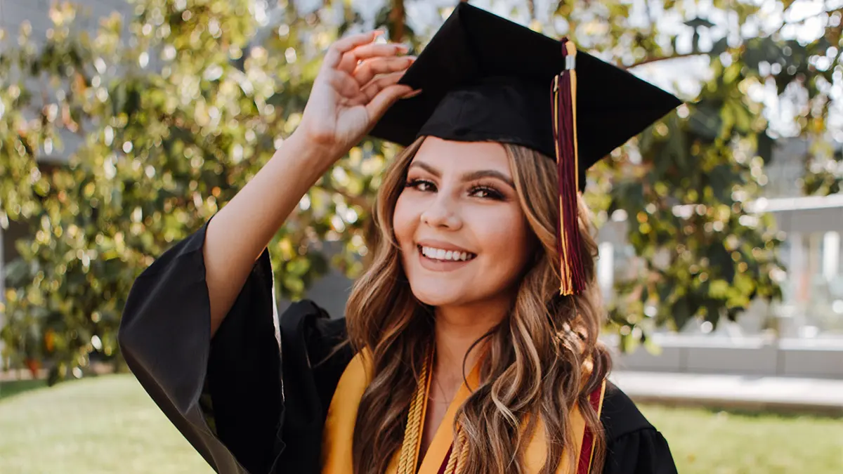 A photo of graduation messages with a female graduate