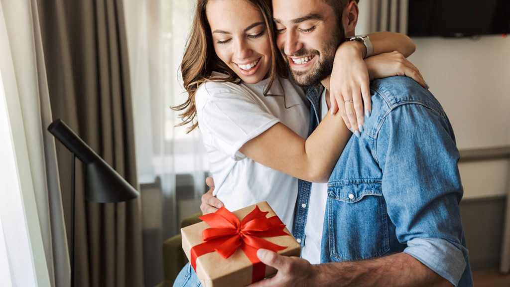 A photo of father's day messages with wife giving husband father's day gift